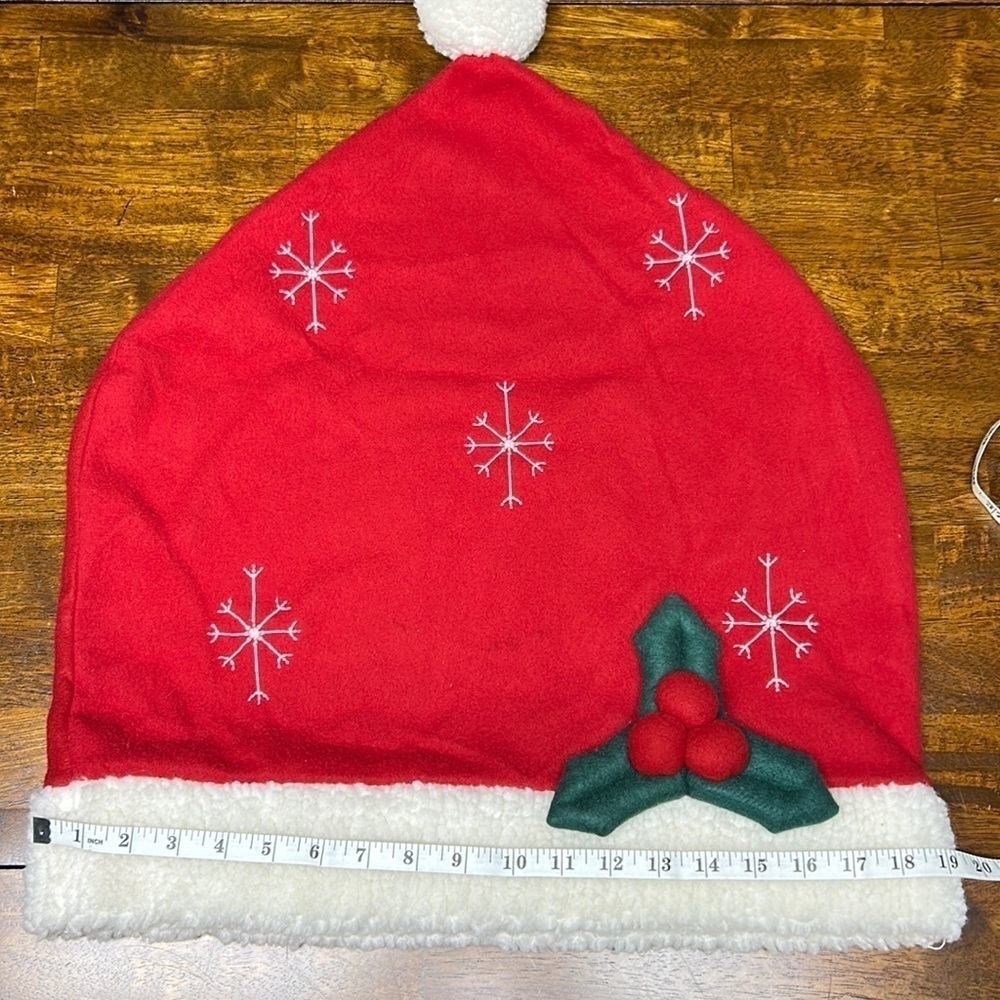 Oversized Santa hat with holly leaves and berries snowflakes Sherpa rim